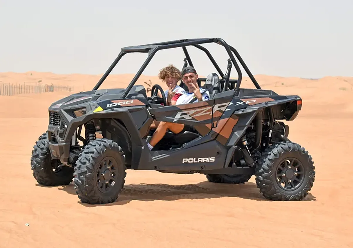 2 Seater Polaris RZR 1000cc dune buggy on red sand