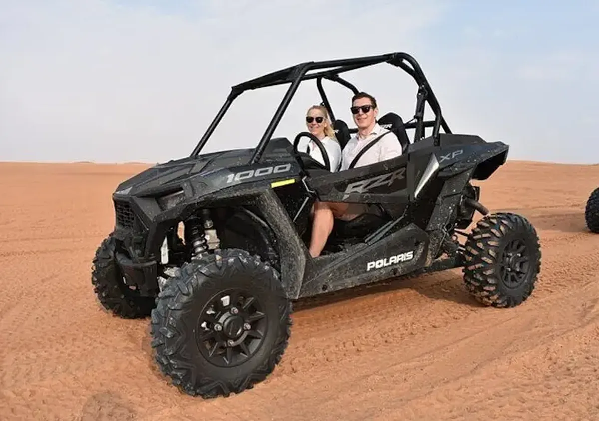 2 Seater Polaris RZR Turbo dune buggy on red sand